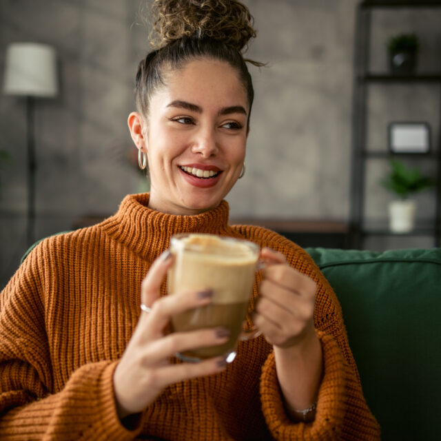 Young Woman Drinking Coffee In The Morning
