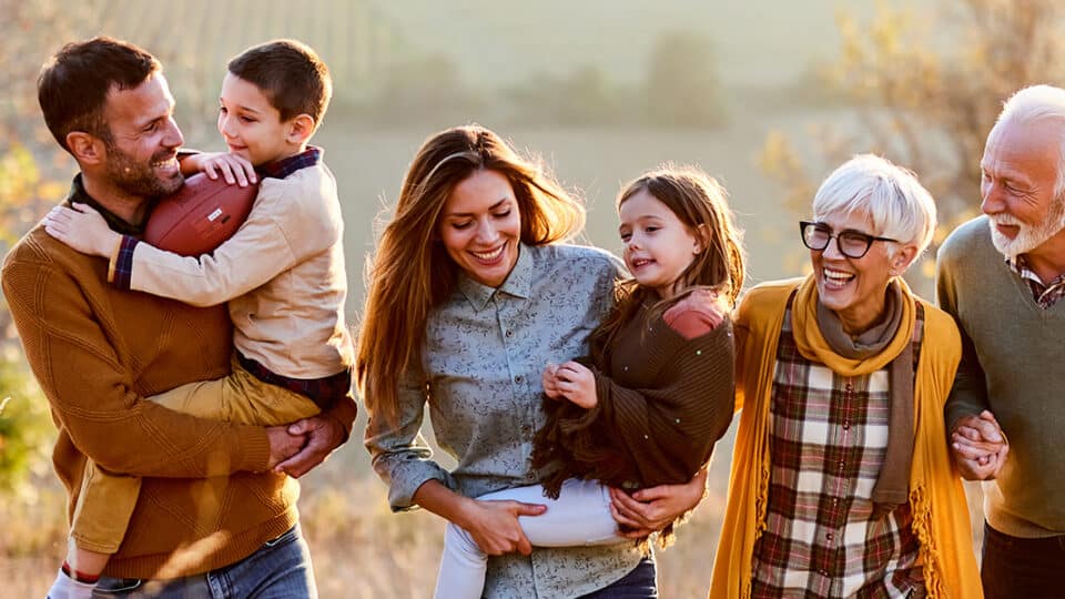 Intergenerational family enjoys being active outdoors together.