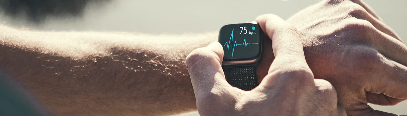 Man Running Outdoors Running Checking Smart Watch Taking A Break