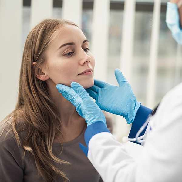 Examining Of Female Patient In Medical Cabinet