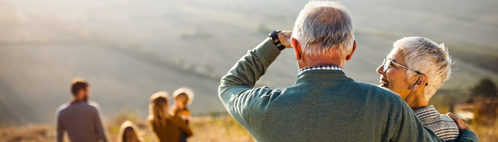 An older couple enjoys time being active with their family.