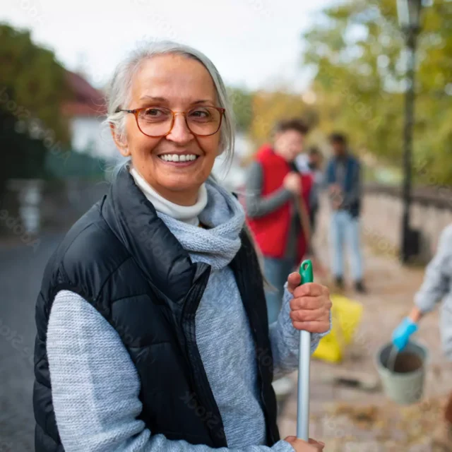 Community member volunteering in the lakes area.