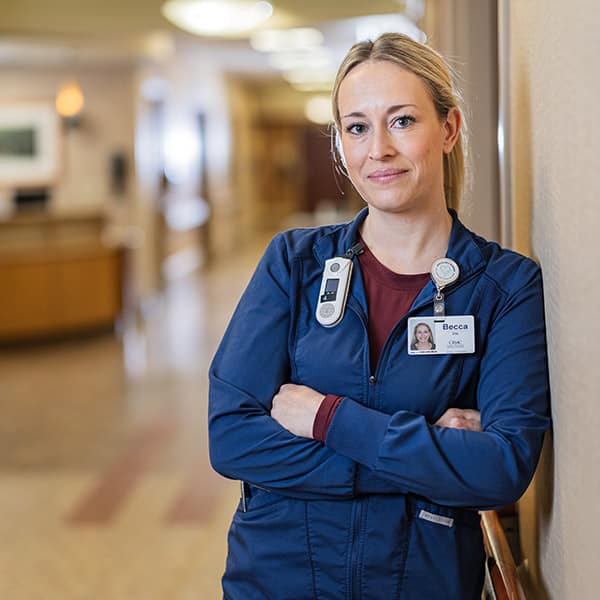 CRMC staff member standing in her clinic.