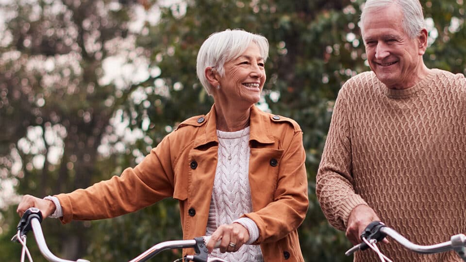 Shot Of A Mature Couple Taking A Bike Ride At Sunset