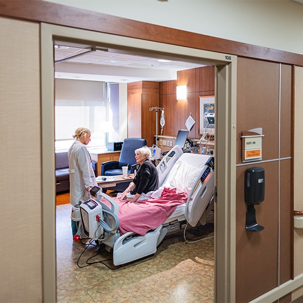 CRMC provider connects with a patient bedside.