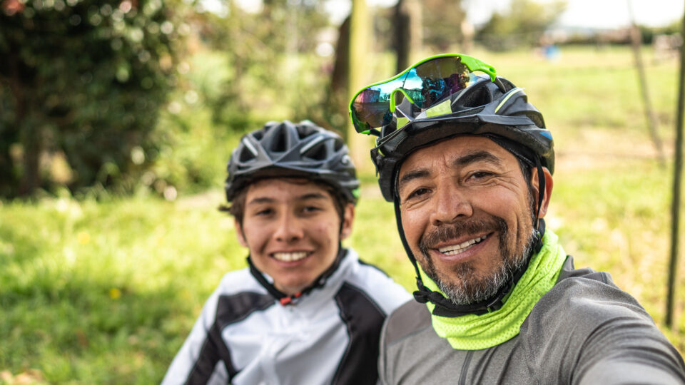 Cyclist Father And Son Taking A Selfie Or Filming In A Rural Place Camera Point Of View