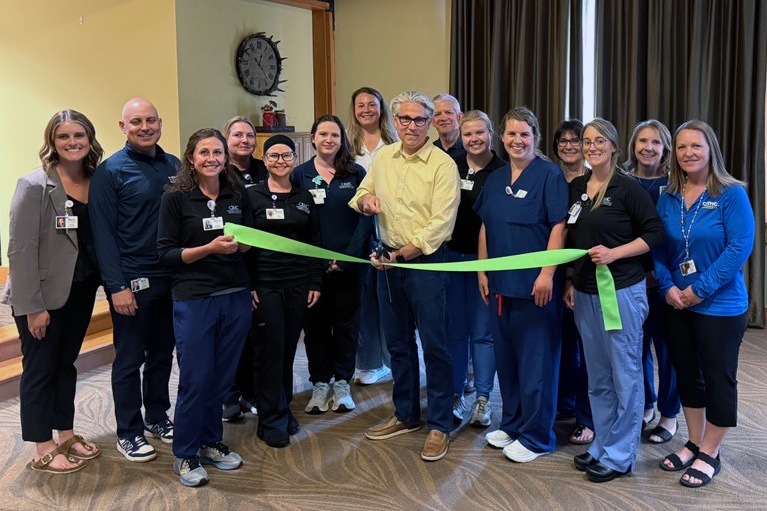 Dr. Brandon Reynolds with the CRMC team celebrating his GreenLight™ Laser Therapy Center of Excellence designation.