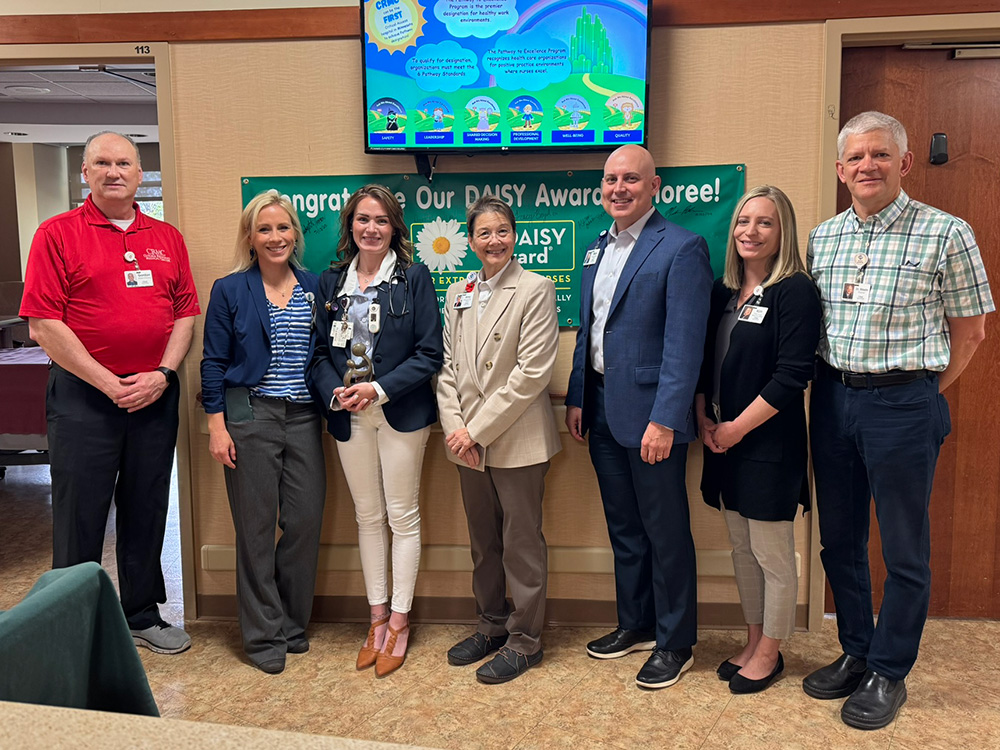 Jessica Mudgett, DNP, honored with the DAISY Award at CRMC, pictured with colleagues during recognition ceremony.