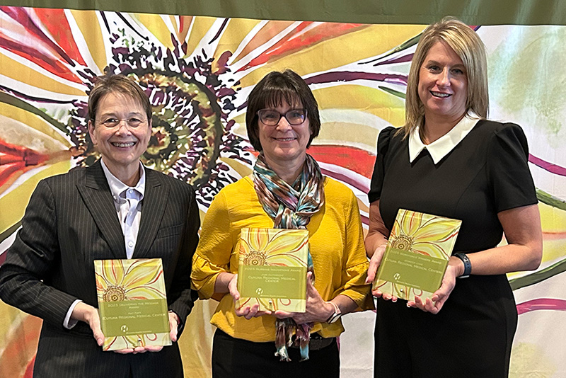 CRMC's Joni Gutknecht, Amy Hart, and Jennifer Lowe accepting an award from the Minnesota Hospital Association.