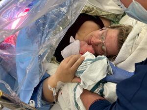 Mother and father bonding with their newborn shortly after delivery at CRMC.