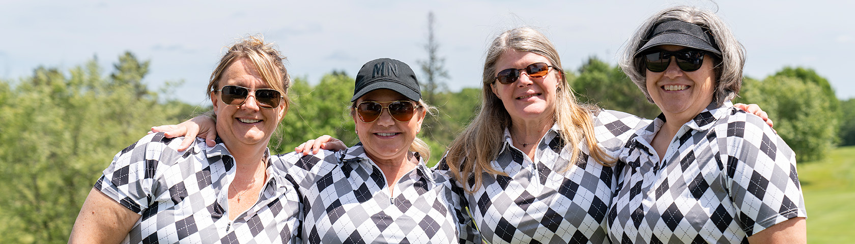 Group od community member enjoying time toegther outdoors.