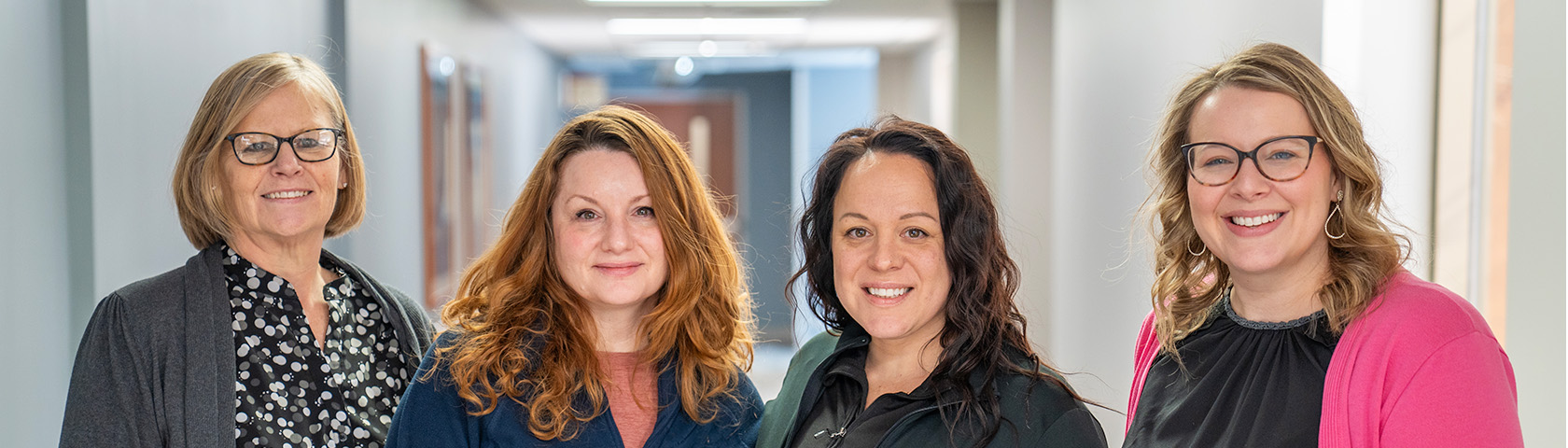 Group Of Young People Stacking Hands Together.