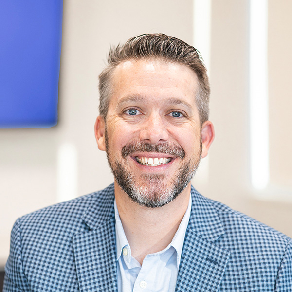 Dr. Kyle Moore, board-certified foot and ankle surgeon at Cuyuna Regional Medical Center, smiling in a professional headshot.