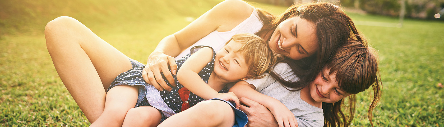 Young parents enjoy a fun moment with their two daughters.