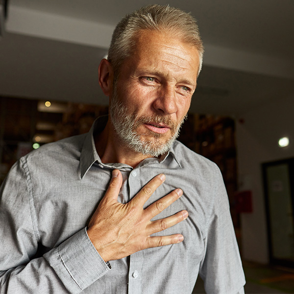Man Suffering Heartburn