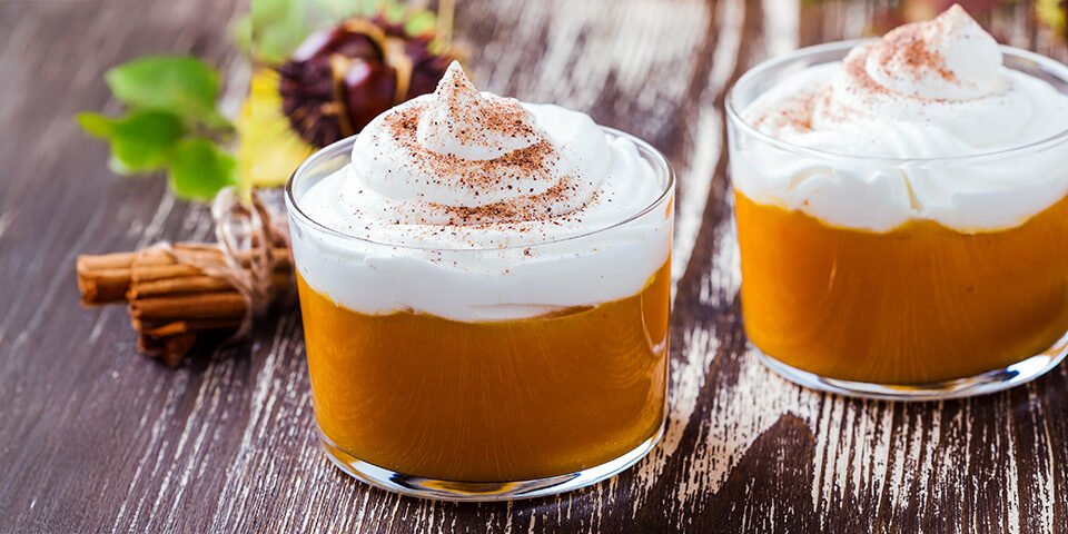 Creamy keto pumpkin mousse served in small dessert cups, illustrating a CRMC healthy holiday recipe