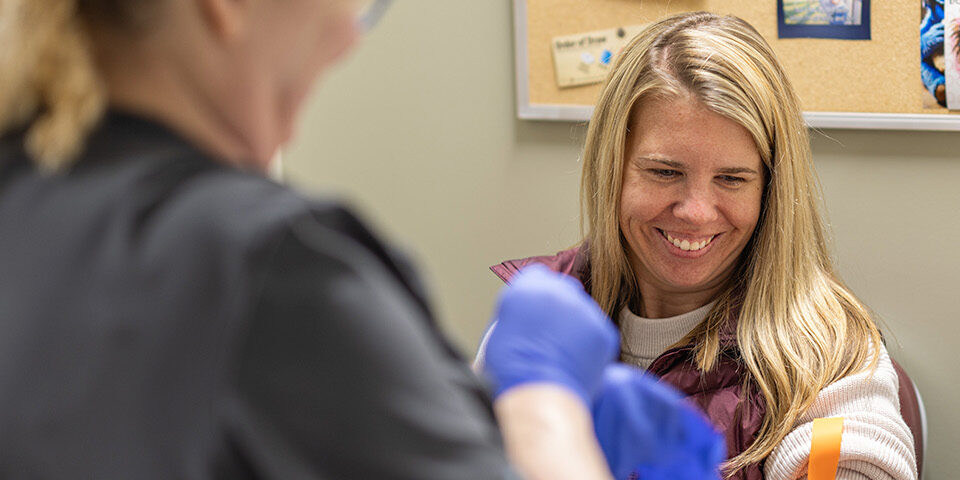 Happy patient getting a blood draw at CRMC in Crosby, MN.