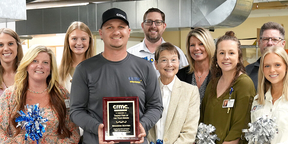 Brandon Schyma posed with CRMC employees receiving the Big Fish award.