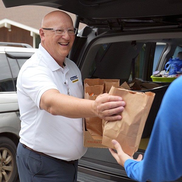 CRMC Lunch Bunch volunteer working to get free meals for kids.